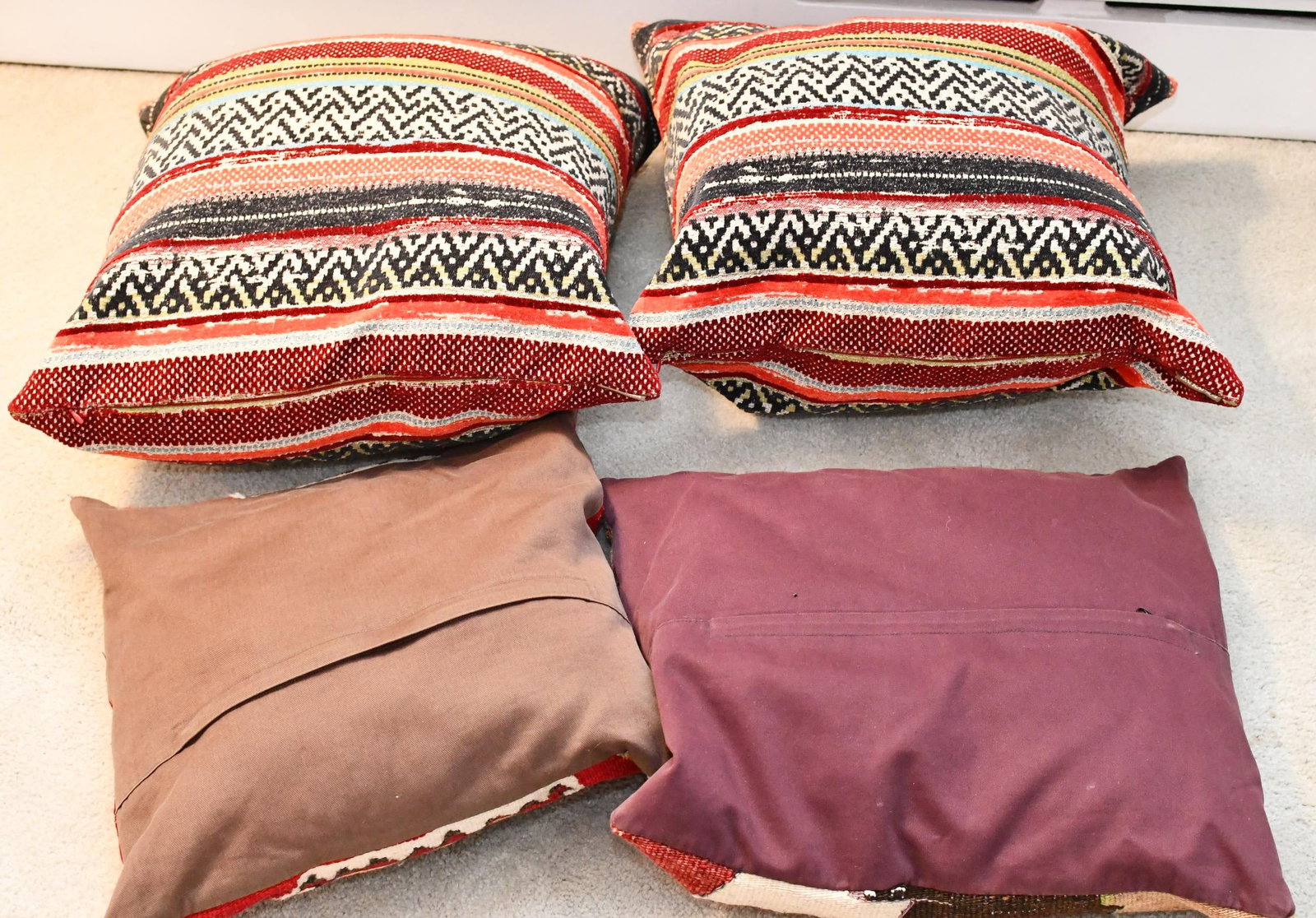 Group of throw pillows: 4 total pillows. southwest pattern , Larger two D.V HOME. 2 - 20"x20" . 1- 16"x18." 1- 15"x17".