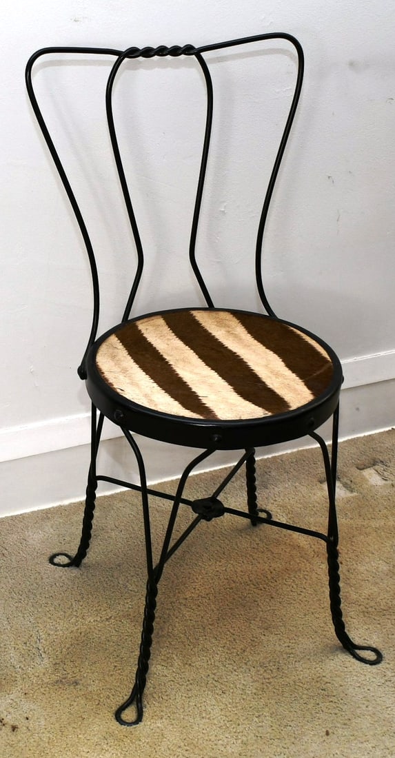 Ice Cream Chair: Zebra hide over wood , wrought iron, fairly worn old bronze finish.(FYI-Zebra head mount later in auction) . READ OUR SHIPPING POLICY'S! This will be In person pick up or contact UPS store in Kenosha,