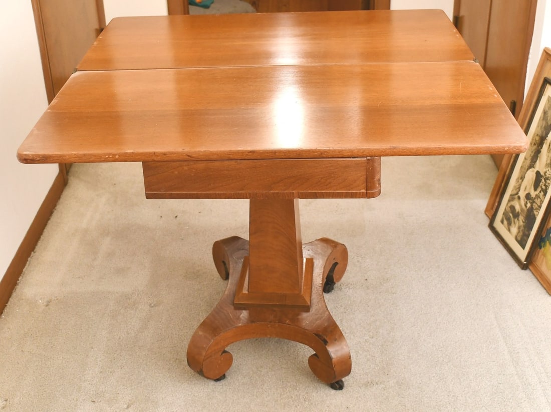 Empire Mahogony Game table: Authentic Empire game table has a folding top that spins and folds open with storage under and has original cast iron casters. READ OUR SHIPPING POLICY'S! This will be In person pick up or contact UPS