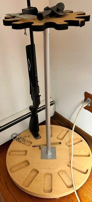 Revolving Gun Rack: Modern & holds 12 long guns. Has a metal center pole making it very sturdy. Made by Affordable gun rack. READ OUR SHIPPING POLICY'S! This will be In person pick up or contact UPS store in Kenosha, or 