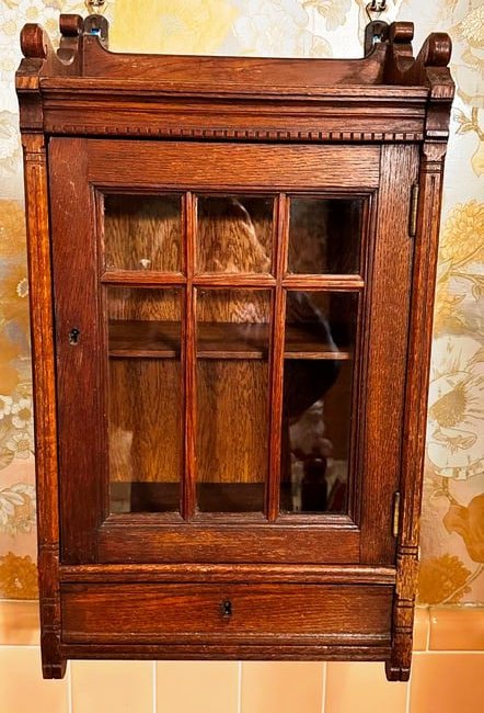 Oak wall hanging medicine cabinet: Oak East Lake cabinet with 1 drawer, 1 glass door. Has original keys for both drawer and door. READ OUR SHIPPING POLICY'S! This will be In person pick up or contact UPS store in Kenosha, or your own s