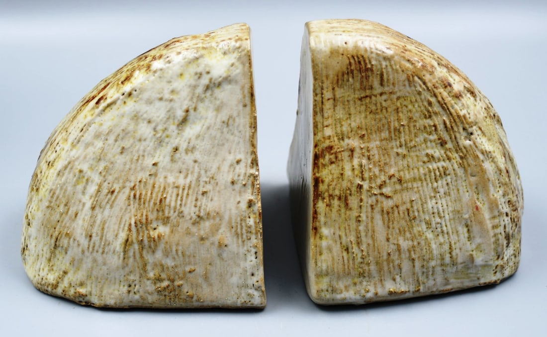 Sculpted Clay Book ends: 2 artist signed. sculptured and glazed bookends (NOTE-Weight and dimensions are before packaging) both ends- 4 1/2"h x 4 1/4"d x 4 1/2"w. Total weight of both ends- 4lbs 10oz.