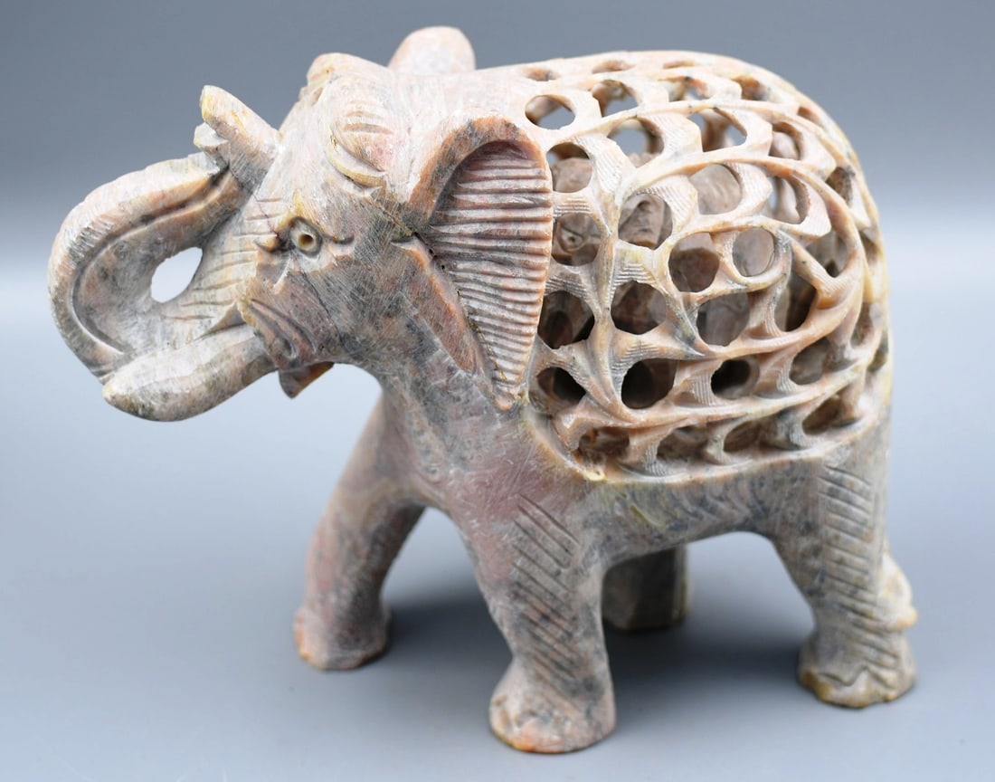 Soapstone Elephant Carving: Carved Soapstone elephant baby inside of mother elephant. Length-7". Approx height-6". Approx width- 3 1/2". Weight- 3lbs 14oz. (NOTE-Weight and dimensions are before packaging)