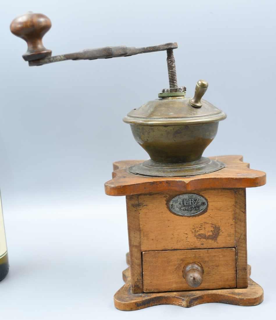 Antique Coffee Grinder: antique German made coffee grinder. Has Family name on front. (NOTE-Weight and dimensions are before packaging) Base and crown dimensions- 5"x 5". Drawer dimensions-3 1/8" x 3 1/2". Total heigh to top