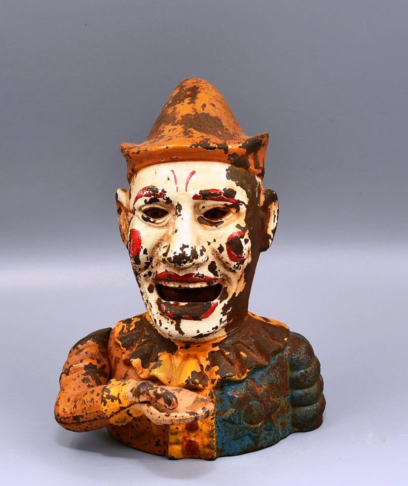 Humpty Dumpty Coin Bank: Vintage Jester Humpty Dumpty mechanical bank. Cast Iron. (NOTE-Weight and dimensions are before packaging) Overall Height-7 1/2". Overall depth-5 1/2". Width- 6". Weight- 4lbs 11oz.