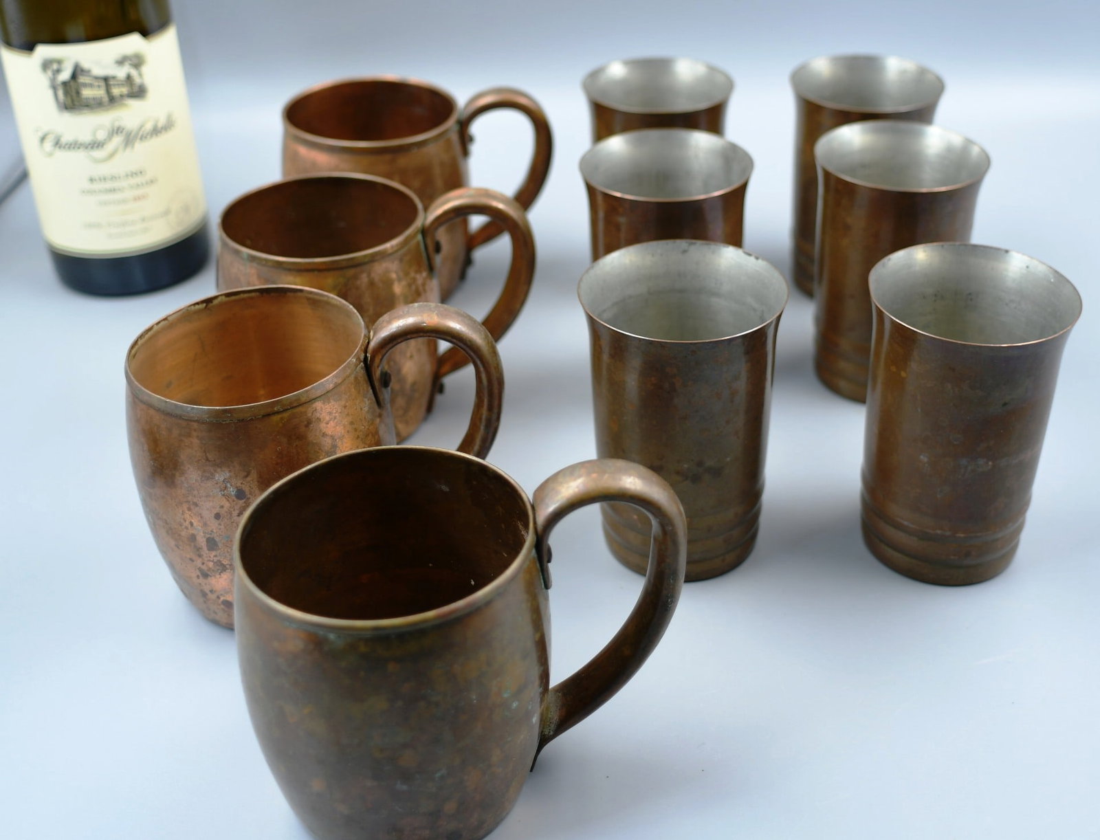 Copper Mugs and Cups: 4 vintage copper mugs and 6 copper cups. (NOTE-Weight and dimensions are before packaging) cup dia.-2 1/2", 4"h. Mug dia.-3", 3 3/4"h. Total weight-3lbs.