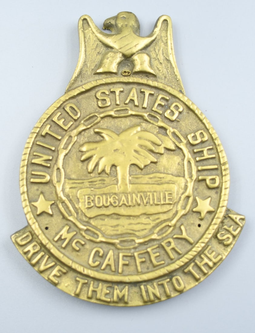 USS McCaffery Ships Plaque: Brass Ship Plaque off the USS McCaffery ship referred to as "Big Mac". Dimensions- 5 3/4"x 4 1/2". Weight- 1lb 2oz. (NOTE-Weight and dimensions are before packaging)