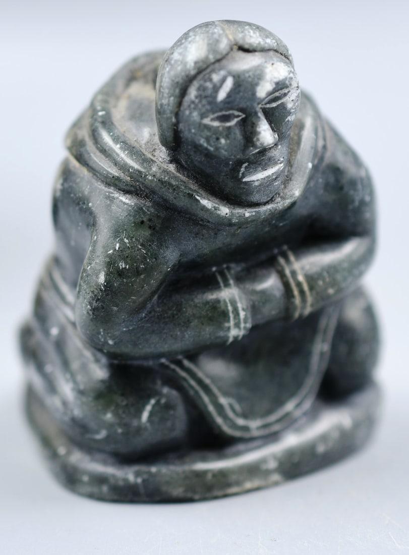 Inuit Sculpture: Inuit sculpture carved from soap stone signed on bottom. (NOTE-Weight and dimensions are before packaging) dimensions- 2 3/4"H x 2"W x 2 1/2"L. Weight- 10.2oz.