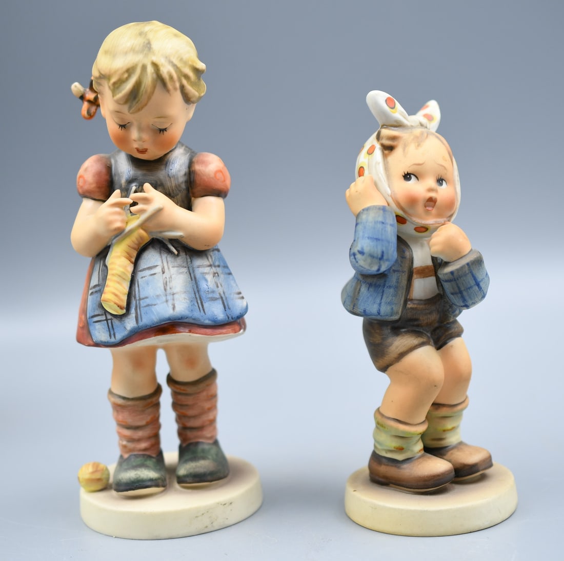 Vintage Goebel Hummels: 2 Vintage Goebel Hummels. #255-1963 , #217-1951. (NOTE-Weight and dimensions are before packaging) #255-6 1/2"T. Base dia-2 1/2". Weight- 6.15oz. #217- 5"T. Base Dia-2 1/4". Weight- 4.25oz.