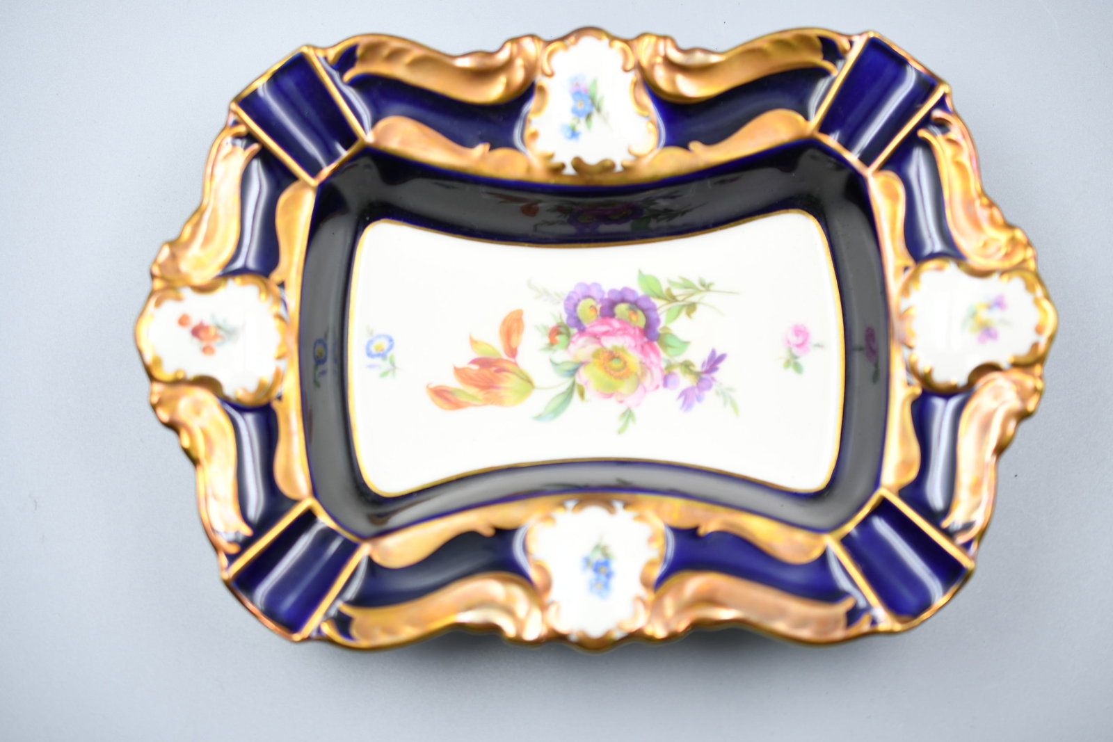 Vintage Kueps Cigar Ashtray: Cobalt Lindner Kueps cigar ashtray (NOTE-Weight and dimensions are before packaging) 8 1/2" x 6". 1 1/2"H. weight- 13.25oz.