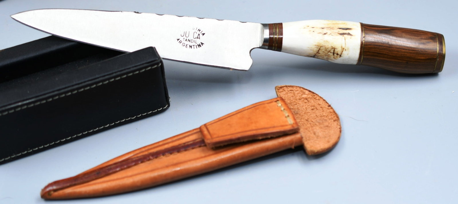 Handmade Gaucho Knife: Handmade Argentinian Gaucho Knife with leather sheath. Bone and wood handle. (NOTE-Weight and dimensions are before packaging) Handle-4". Blade-5 1/2". Weight- 4.7oz.
