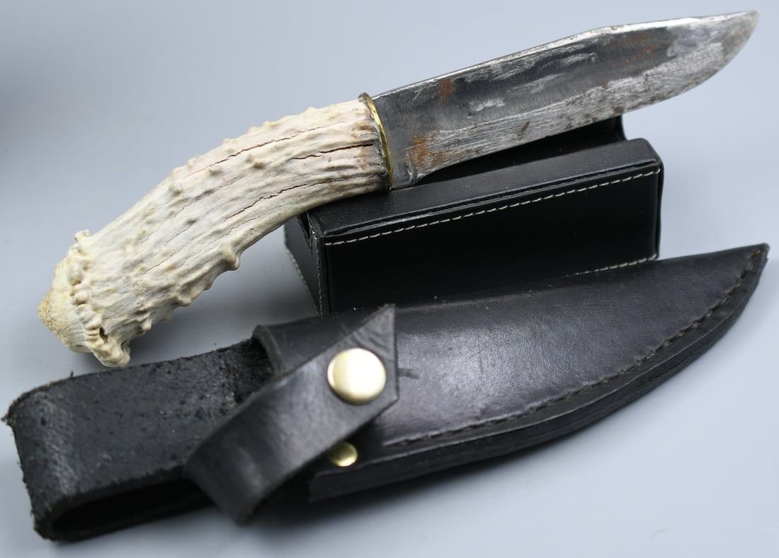 Handmade Knife: Handmade knife with antler handle, with leather sheath. (NOTE-Weight and dimensions are before packaging) handle-4 1/4". Blade-4 3/4". Total weight- 8.25oz.