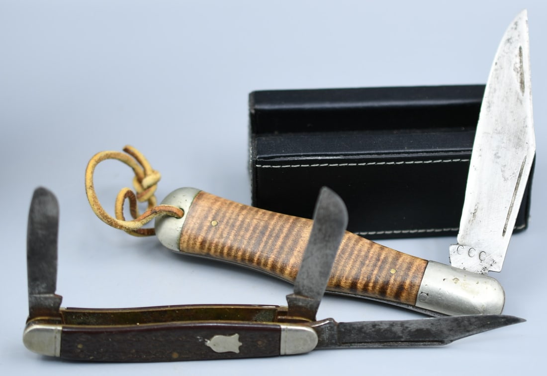 2 Camillus Knives: 2 Camillus Cutlery Co. folding knives. Smaller knife is #67. Larger knife has CCC on blade. (NOTE-Weight and dimensions are before packaging) lengths-5 1/4", 3 7/8". Blade length-4"(CCC), 3"(#67) Comb