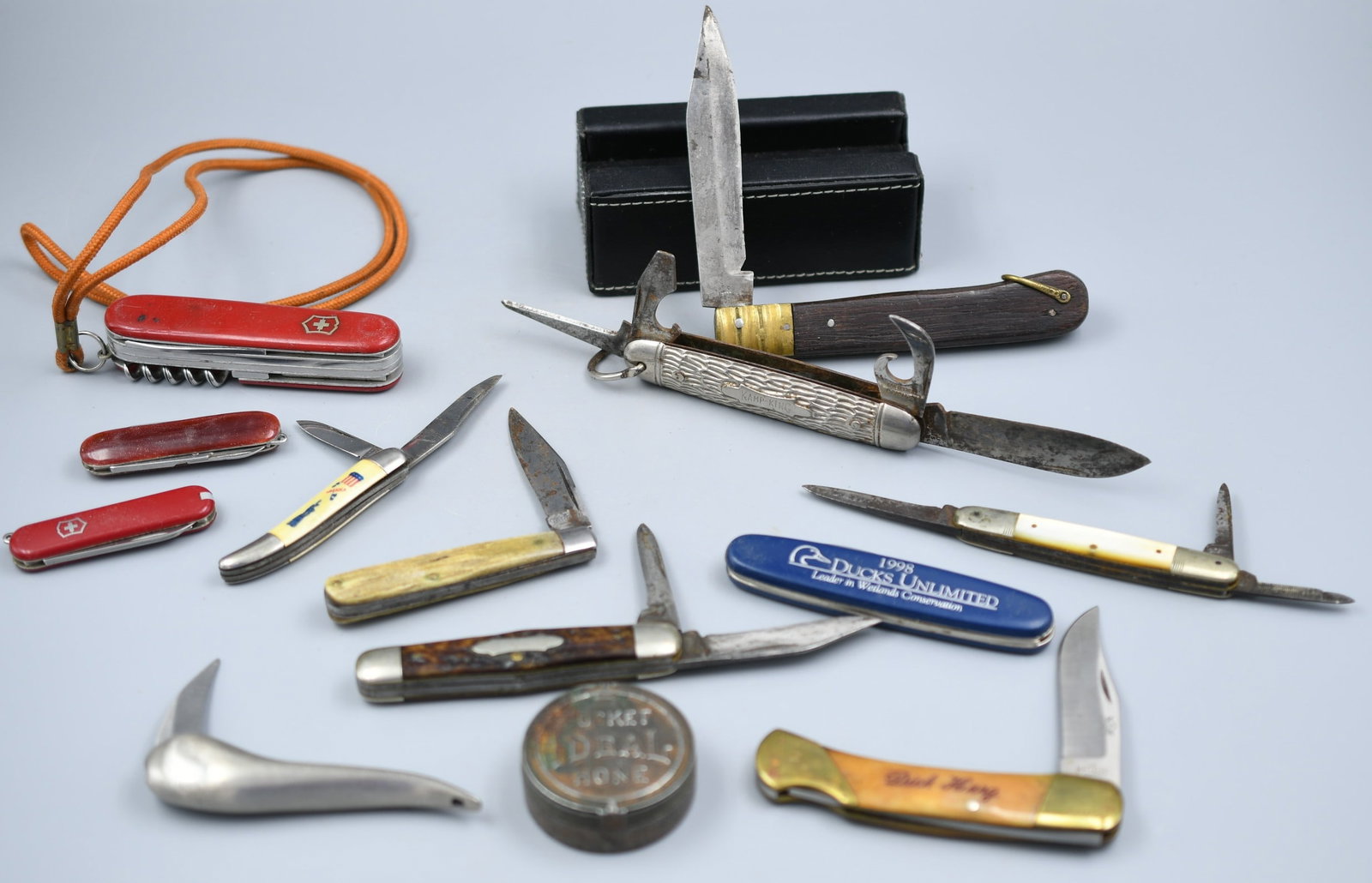 13 piece knife lot: 11 knives, 1 Swiss army knife, 1 pocket hone. See photos. (NOTE-Weight and dimensions are before packaging) see photos- Combined total weight- 1lb 7.9oz.