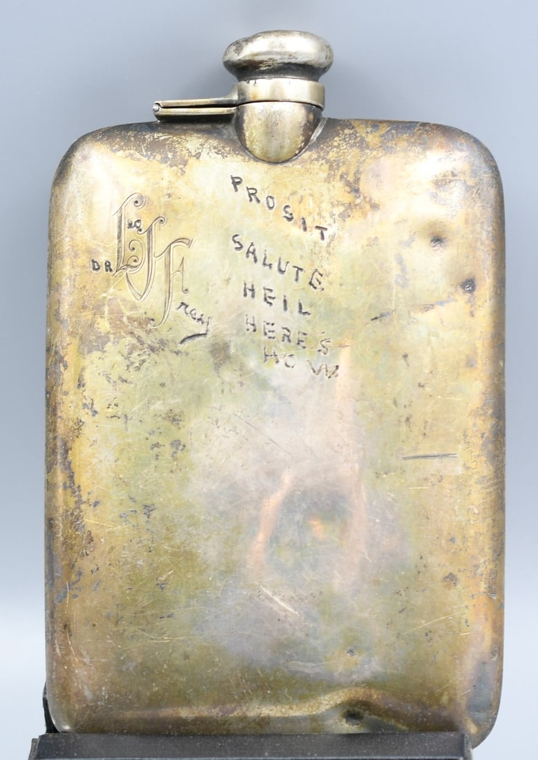 Sterling Silver Flask: Sterling Silver flask with etchings. (NOTE-Weight and dimensions are before packaging) 1/2 PT capacity. 7"Lx 4 ++-1/2"W x 1/2"D. weight- 9.75oz.