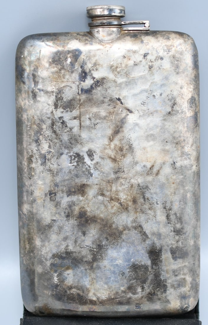 Silver Plated Flask: Silver plated flask with a collapsable single shot lid. Monogram on the front JSW (NOTE-Weight and dimensions are before packaging) dimensions-5 3/4"L x 3 1/2"W x 1 1/4"D. Weight-10.4oz.