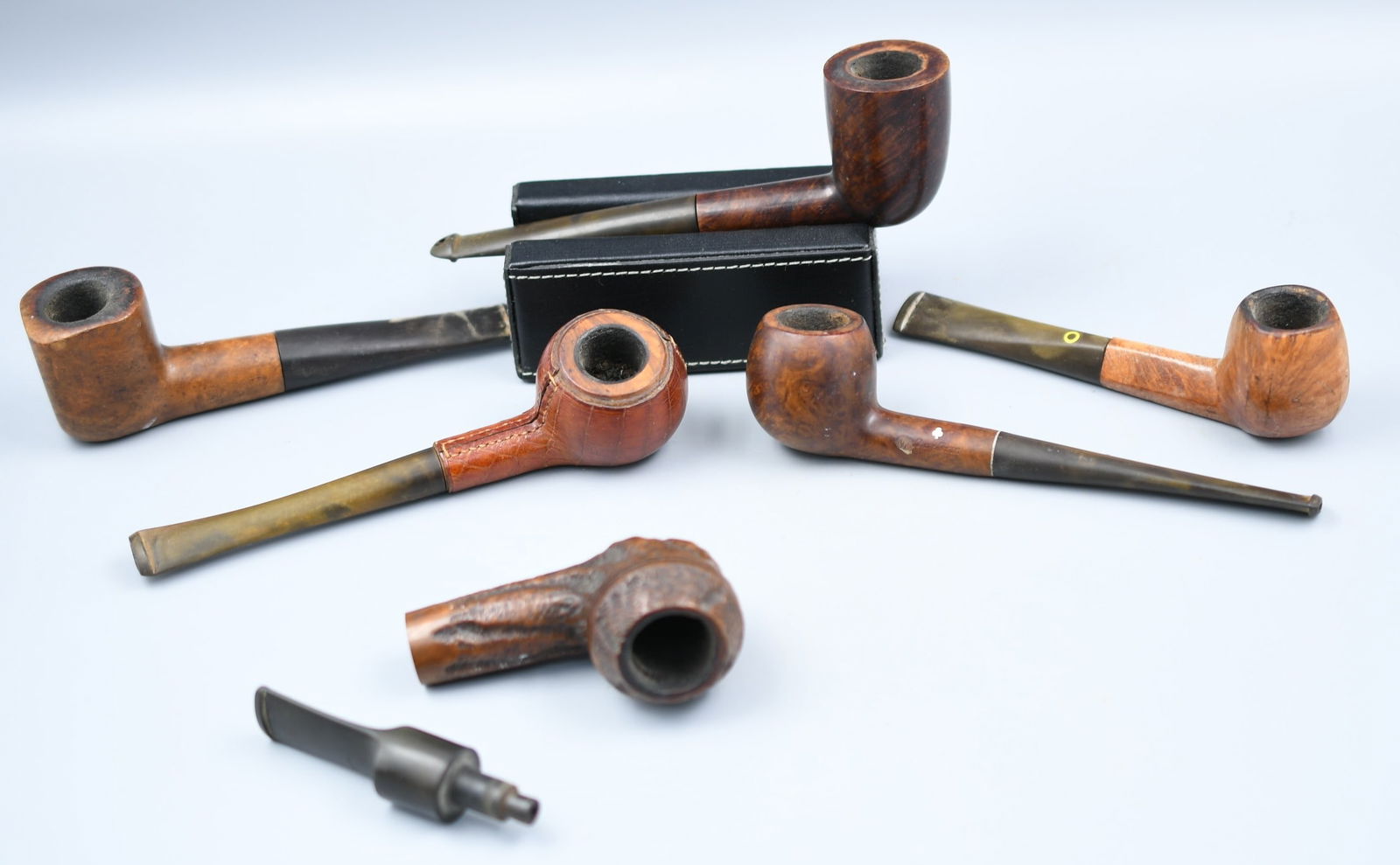 Tobacco Pipe Lot: 6 wooden pipes; 1-Custom Built imported Briar, 1-Emperor Imported Briar "Supreme", 1-LongChamp leather wrapped(France), 1-"Killarney" London made, "A" Petersons Product 320, 1-SuperGrain Kaywoodie, Gr