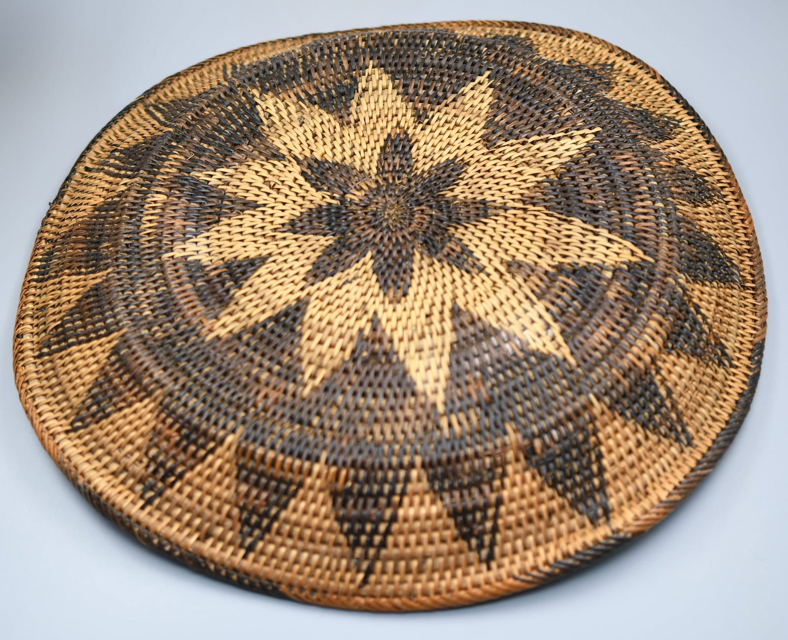 Basketry: hand made basketry. dimensions-Dia-15", 2"height. Weight-12.5oz. (NOTE-Weight and dimensions are before packaging)