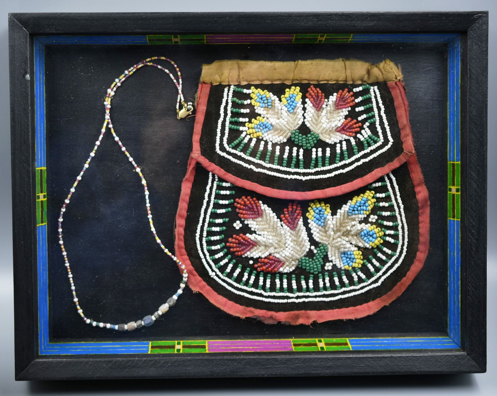 Native American Beaded bag: Native American beaded bag/purse in a nice decorated shadow box along with a beaded necklace. (NOTE-Weight and dimensions are before packaging) Shadow box dimensions-12 3/4" x 9 3/4" x 2". Weight-1lb 
