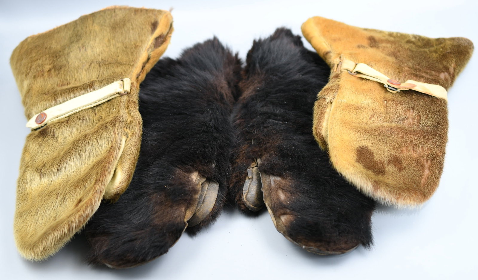 Antique Buck skinner Mittens: 2 pair of Antique handmade mittens. Both natural fur and leather. (NOTE-Weight and dimensions are before packaging) mitten length-13 1/2"L. Wrist width- 8"-9 1/2" on both. Combined weight of both pair