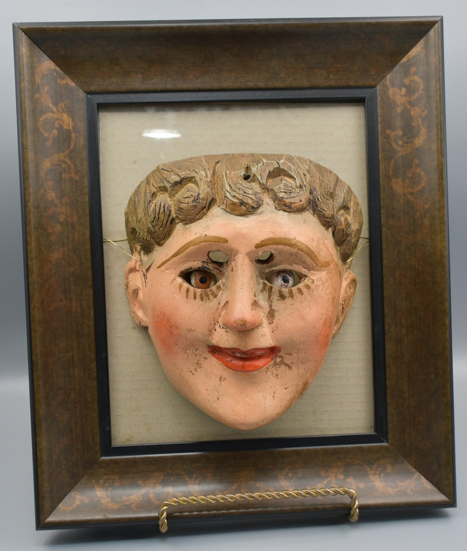 Guatemalan Dance Mask: Believed to be late 19th century traditional hand carved wooden dance mask. Mask is loosely mounted to a frame by a wire through the original mask string holes. dimensions-Mask- 7"L x 6 1/2"W x 4 1/2"