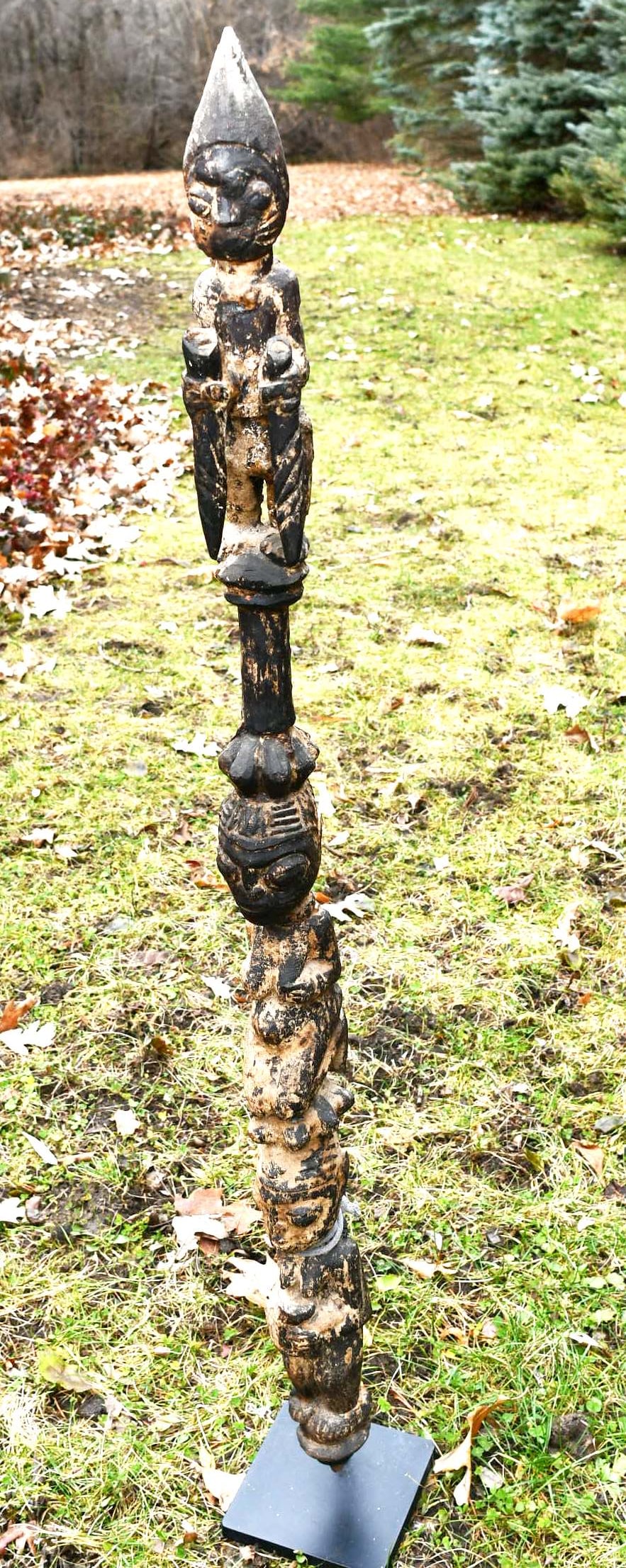African Figural Staff: African carved wood staff 3 figures carved on top of each other. Sits on a custom stand. (NOTE-Weight and dimensions are before packaging) dimensions-45"L. Handle-1 1/2" dia. Weight-9 lbs. 7oz. (NOTE-