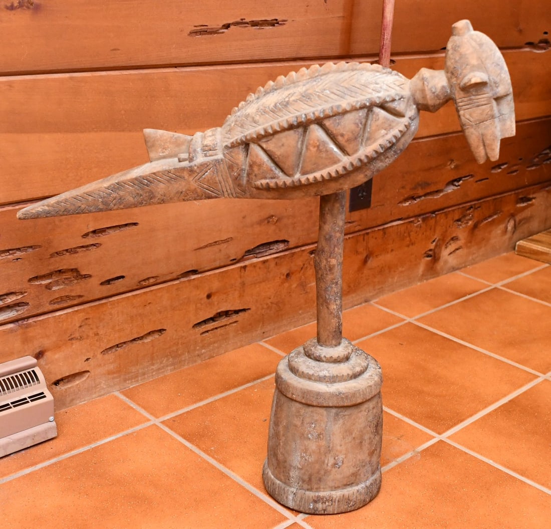 African Baga Anok Headdress: Antique African Wood carving resembles a bird with a human face between its wings. Possibly Baga Tribe, Guinea Machole Bird Baga Anok Headdress Total Height-26 1/4". Total length-27 1/2". width-4 3/4"