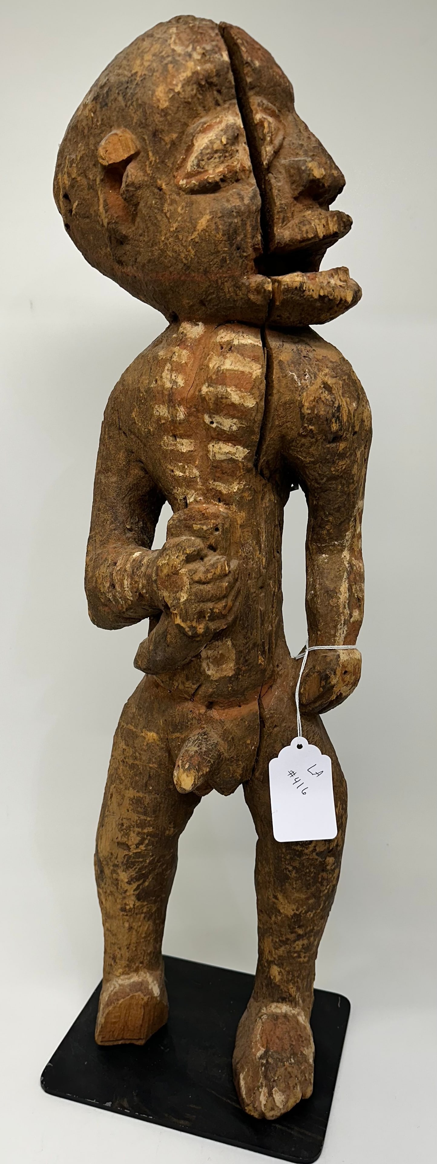 30" Antique African Man Carving: Very old African wood carving. Dr Herz collected quality tribal pieces from around the world but is not able to help identify them, so we made our best attempt to identify them. Please do your own res