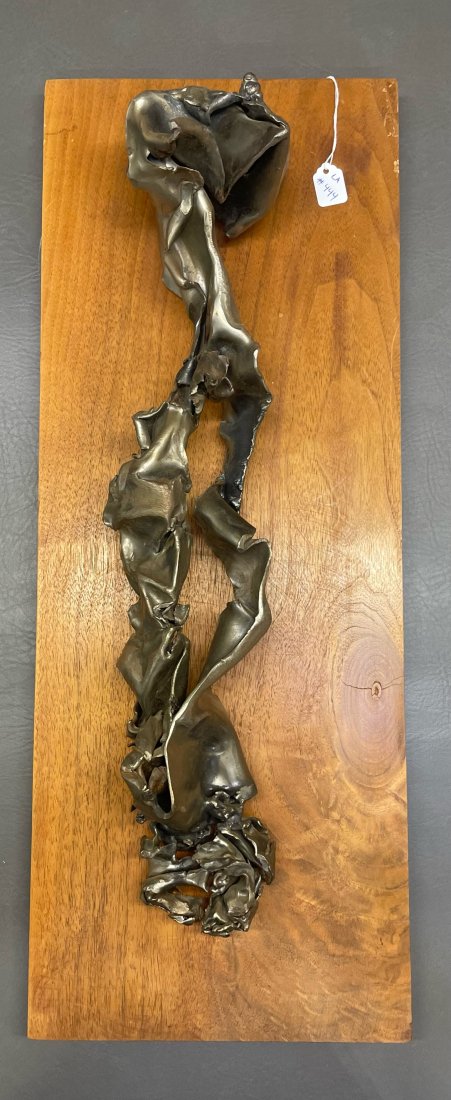 Metal Sculpture: Unique metal sculpture mounted on wood and hangs on the wall.(NOTE-Weight and dimensions are before packaging)