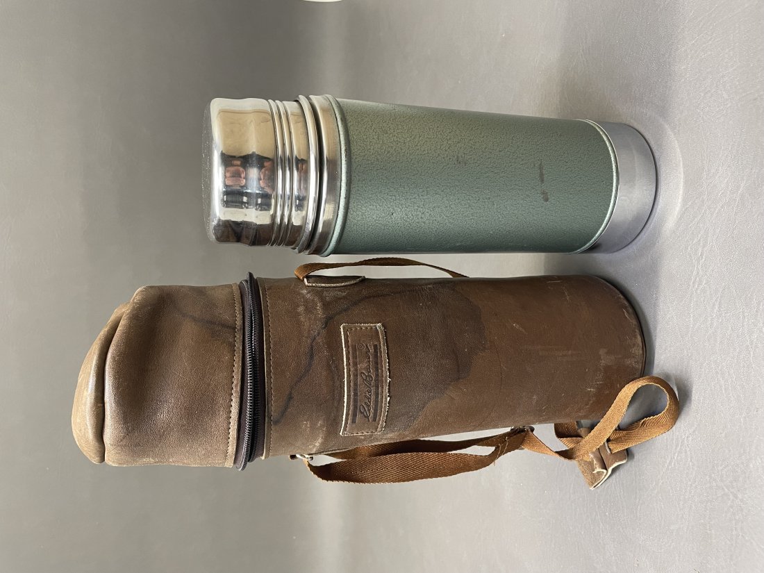 Stanley Thermos in Eddie Bauer Leather: No. A-1357B MFG by Aladdin 11.75" x 4" Stanley Thermos enhanced with an Eddie Bauer Leather case. (NOTE-Weight and dimensions are before packaging)