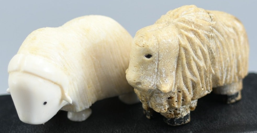 Inuit Carvings: 2 Inuit bone carvings of Muskox. (NOTE-Weight and dimensions are before packaging) Dimensions-(1)-2"L x 1 1/2"H x 5/8"W. Weight-1.2oz. (2)-2"L x 1 5/8"H x 1"W. Weight-1.45oz.