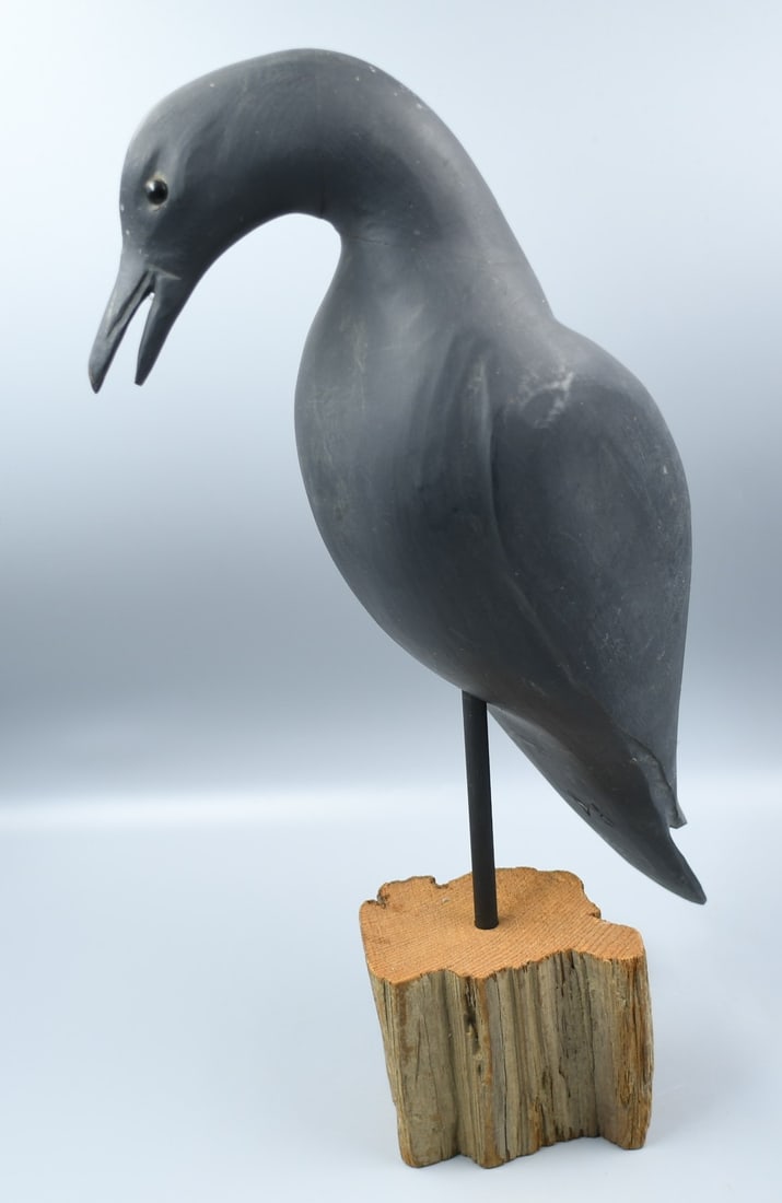 Crow wood Carving: Crow wood carving on a pedestal, Initials carved under tail P.A. (NOTE-Weight and dimensions are before packaging) base dimensions-3"x 4 1/4 x3 5/8". 17 3/4"H. top to tail-17 3/4"L. weight-2lb 3oz.