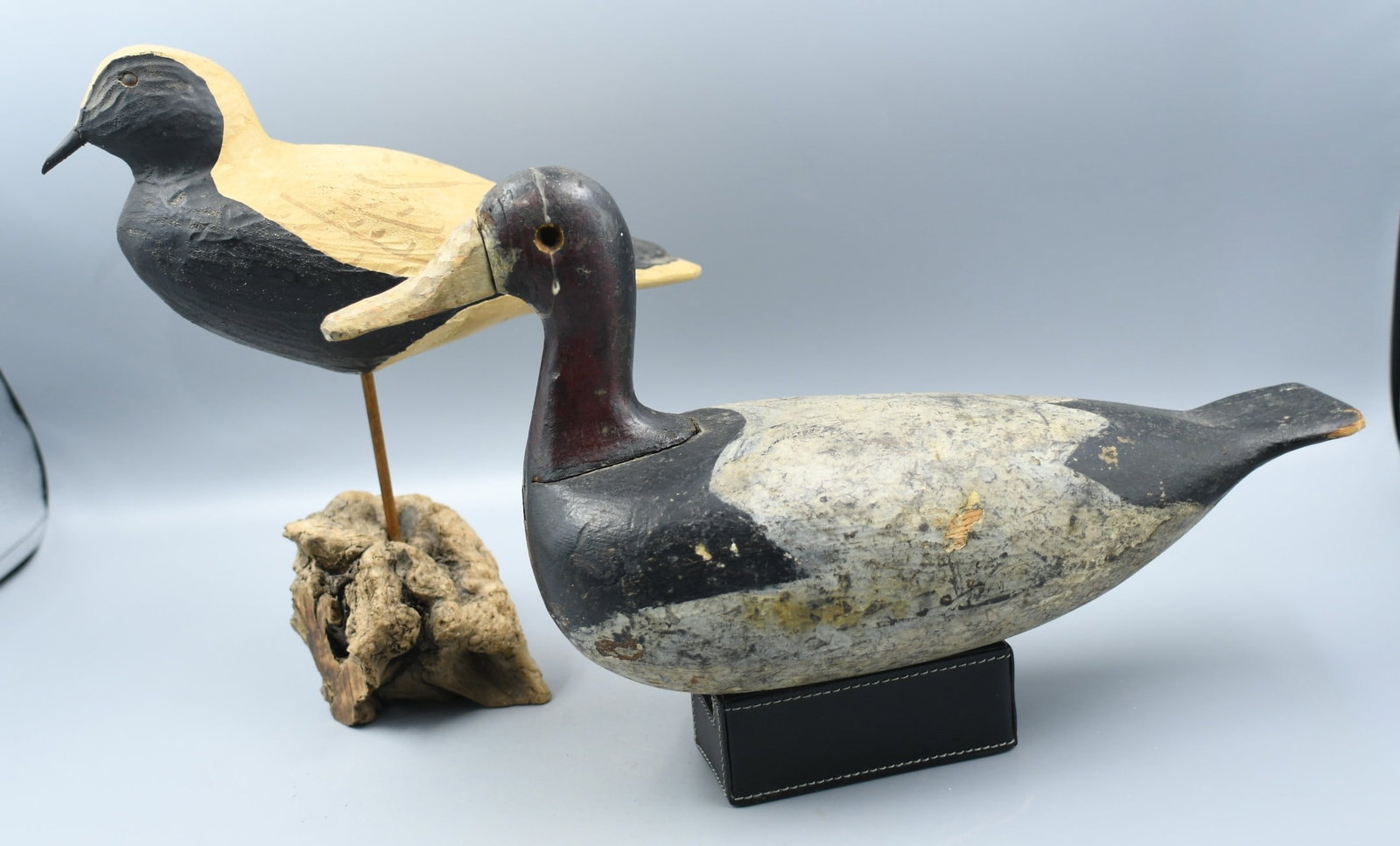 2 wood carved Decoys: 2 hand carved and painted Birds. (1) shore bird, (2) is a solid wood working decoy with 2 small built in lead weights. (NOTE-Weight and dimensions are before packaging) (1)-Base-6 5/8"x 2 3/4". Overal