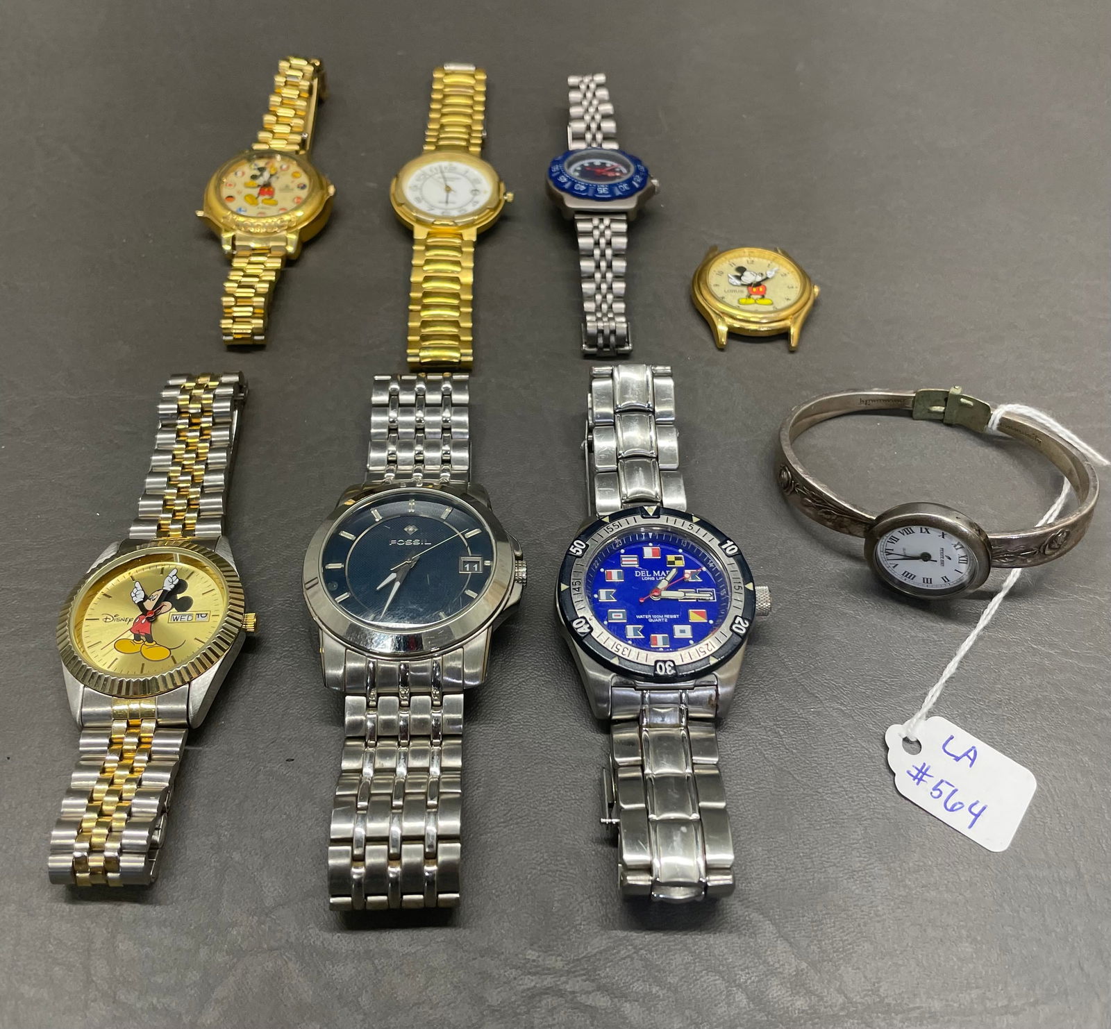 Wrist Watches Lot of 8: 1- Fossil, 1- Del Mar, 1- Disney ewatchfactory, 2- Disney Lorus, 1- Visage. 1- Givenchy, 1- Peyote Bird, Plated silver( Has been home repaired).