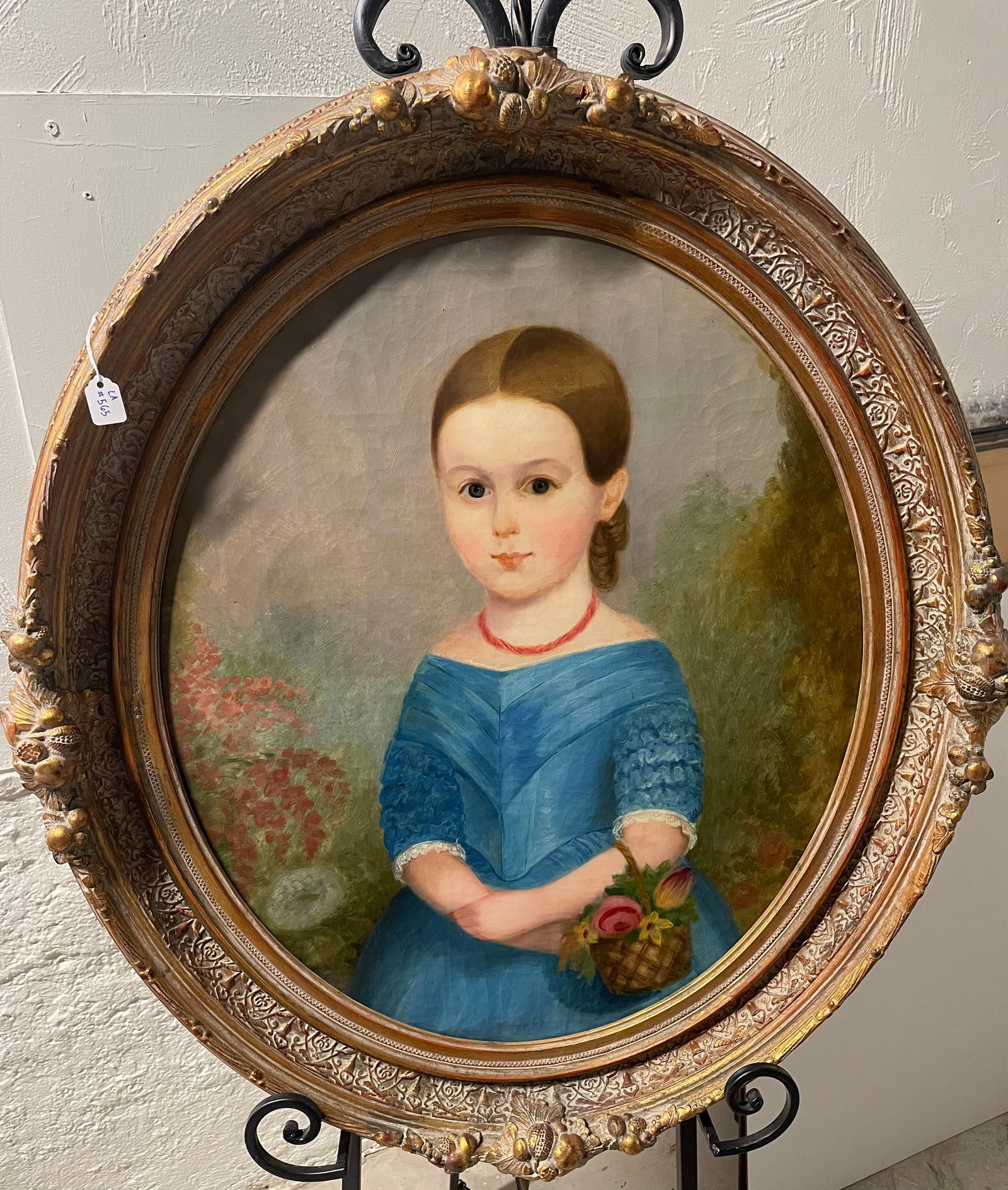 Oil Painting: Oval oil painting of Girl in Blue Dress on canvas in an antique wood frame & stretcher, Canvas-20" x 24". Frame-26 3/4" x 30 1/2". All framed art will be shipped through the Stoughton, WI UPS store.