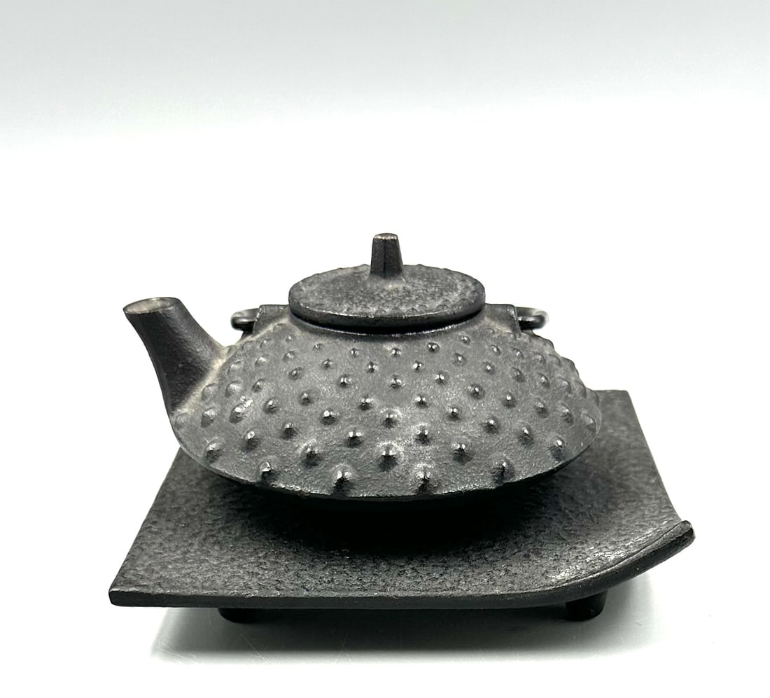 Cast Iron Japanese Tea Pot: ThisKotobuki tea pot is 3-1/2" in diameter& its stand is 4.25" square