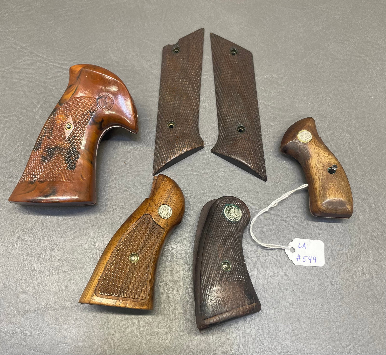 Hand Grip Lot: Handgrip Lot. 5 grips. 1 Rossi Revolver. 1 early Colt grip. 1 Charter Arms Revolver. 1 Smith & Wesson K-Frame. 1 High Standard Semi-Auto Grip.