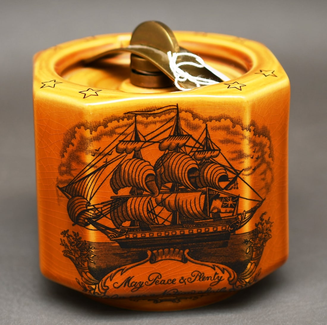 Dunhill Tobacco Jar/ Humidor: Dunhill Ceramic Tobacco Jar/ Humidor with a twist lock on a spring. Nautical scene with and on the reverse side "The Sailers Tear" Poem, and stars printed on the top. Dimensions given are for the item