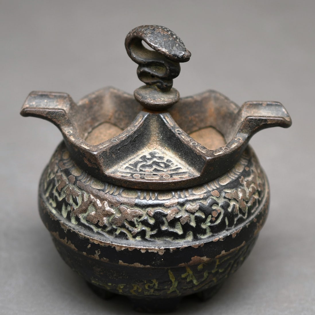 Alfred Dunhill Cast Iron Ashtray: This is cast iron and signs of green paint, the top spins to open for dispensing ashes into the base, the top pulls up and is secured to the base with a spring. Please see photos. Dimensions given are