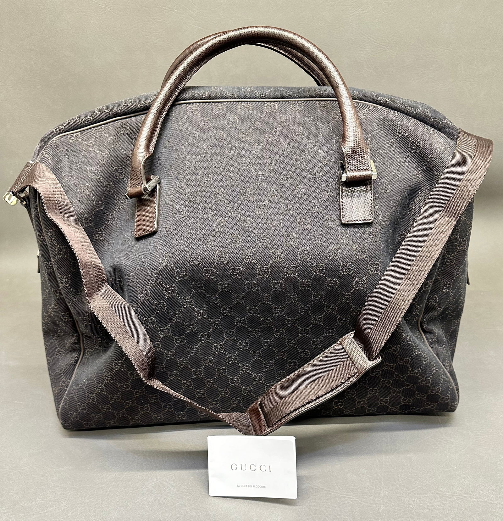 Gucci Handbag/Duffle With Storage Bag: model GG 190629 F5DDN with all original tags & shoulder strap. Dimensions given are for the item(s) & weight is with the packaging.