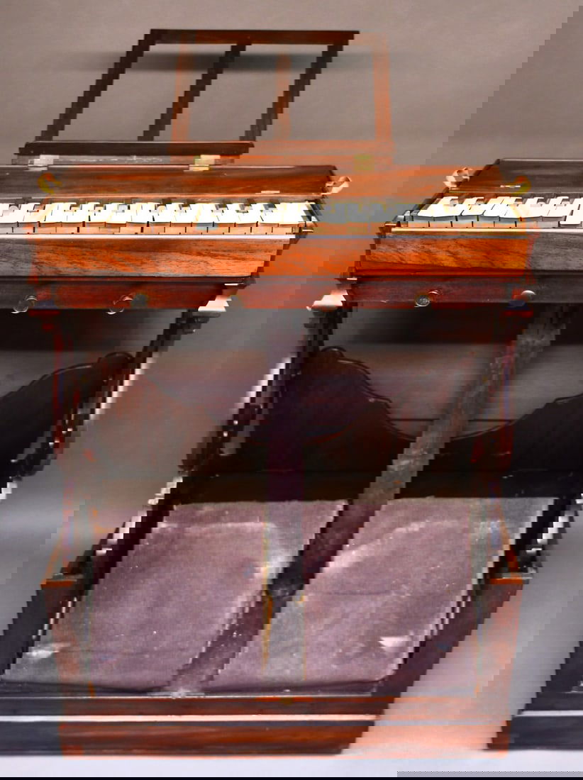 Antique Portable Collapsible Pump Organ: This unusual find is a rosewood case organ with brass handles & hinges, and Ivory & Ebony keys. Dimensions given are for the item(s) & weight is with the packaging.