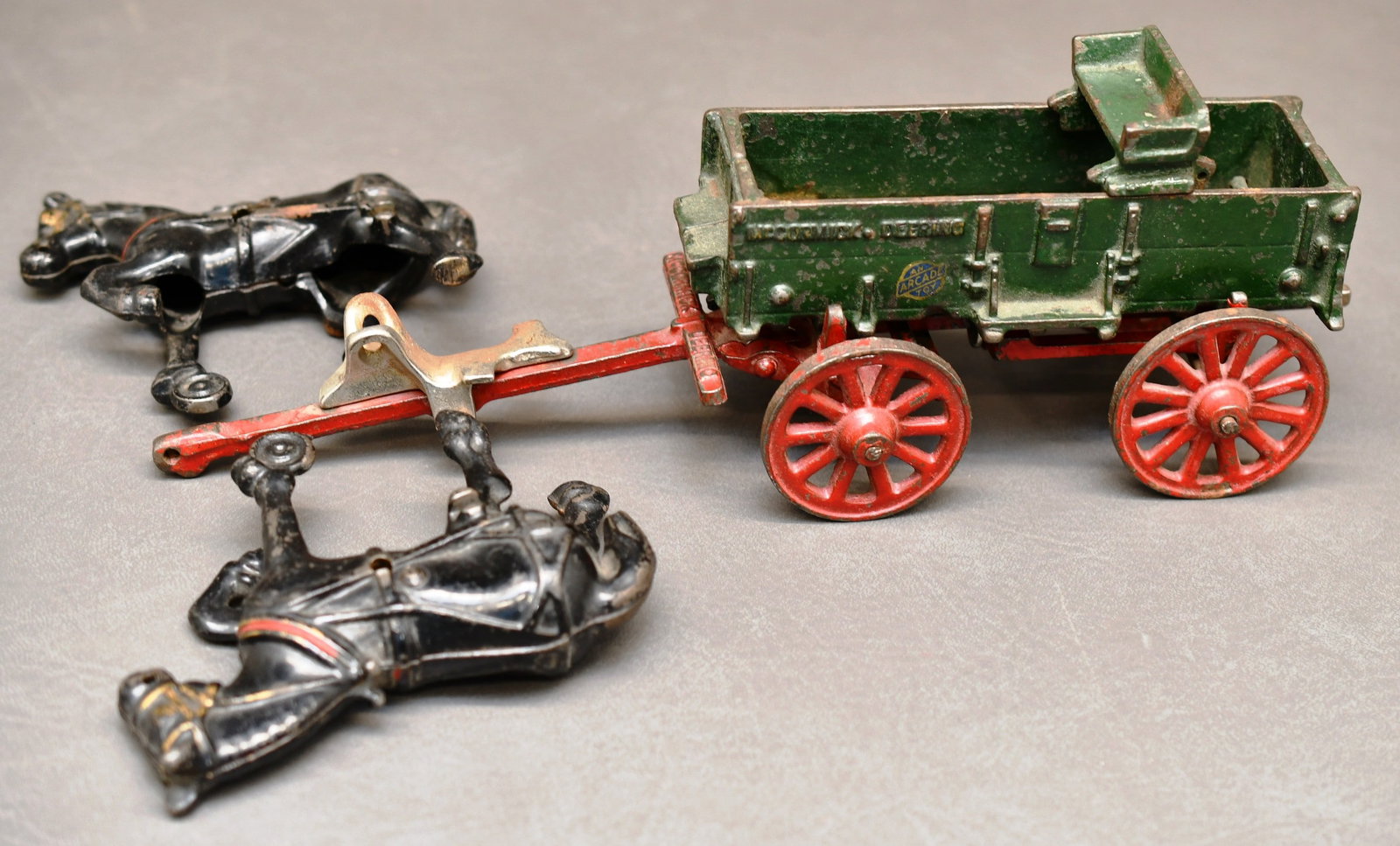 Arcade Cast Iron McCormick Deering Wagon & Horses: An Arcade Toy lable is on the side of this McCormick Deering Farm Wagonwith a team of horses. Dimensions given are for the item(s) grouped as prepared for packing & weight is with the packaging.