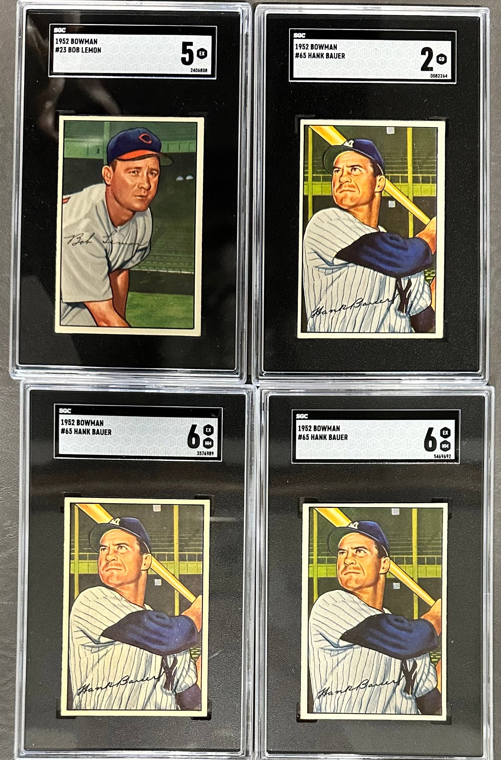 4- 1952 Bowman Baseball SGC Graded Cards: no 23 Bob Lemon Grade 5 SGC no 2406808, no 65 Hank Bauer Grade 2 SGC no 0082264, 2 Graded 6 no 65 Hank Bauer SGC no 3576989 & no 5469692