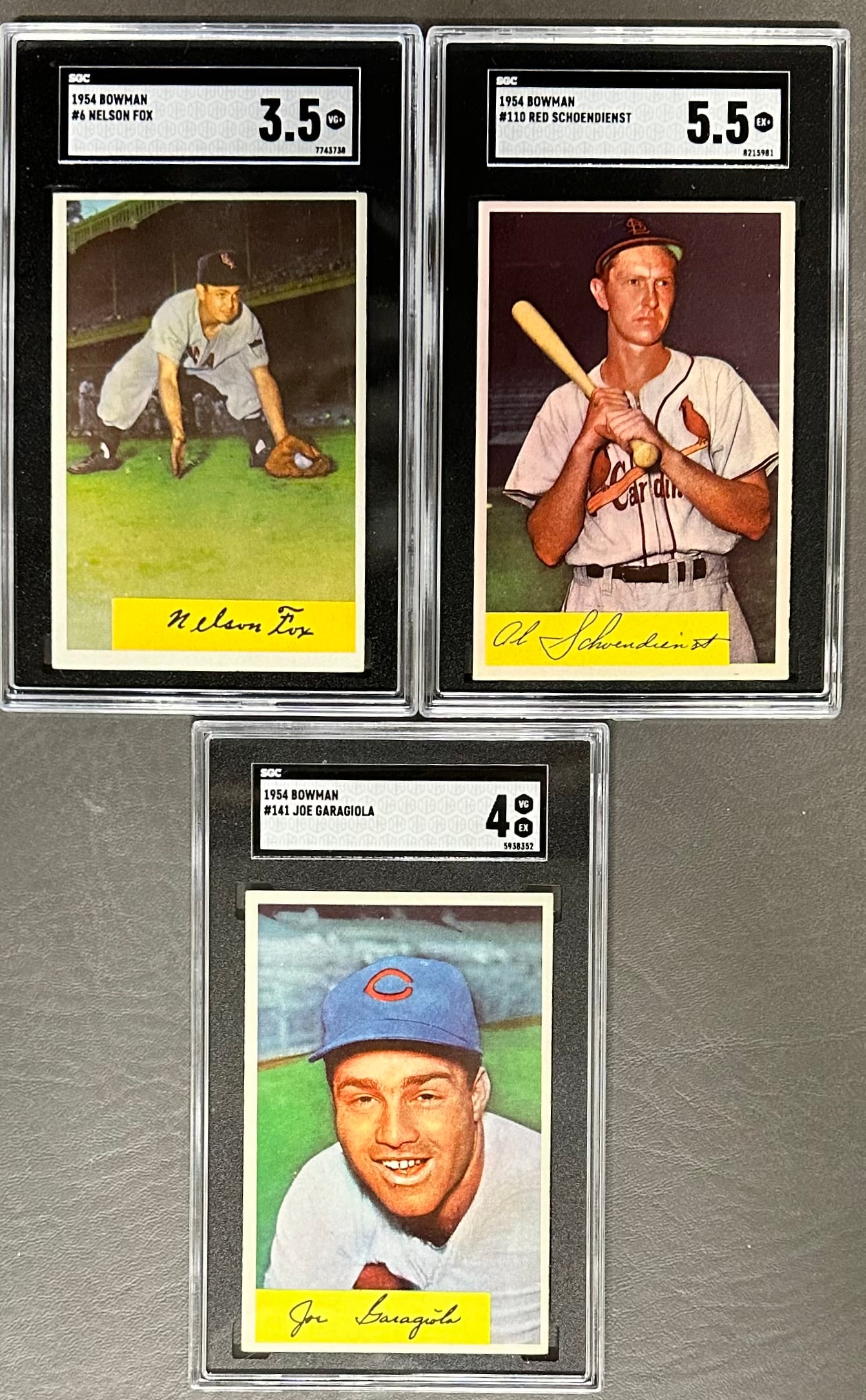 3- 1954 Bowman Baseball SGC Graded Cards: no 6 Nelson Fox Graded 3.5 SGC no 7743738, no 110 Red Schoendienst Graded 5.5 SGC no 8215981, no 141 Joe Garagiola Graded 4, SGC no 5938352