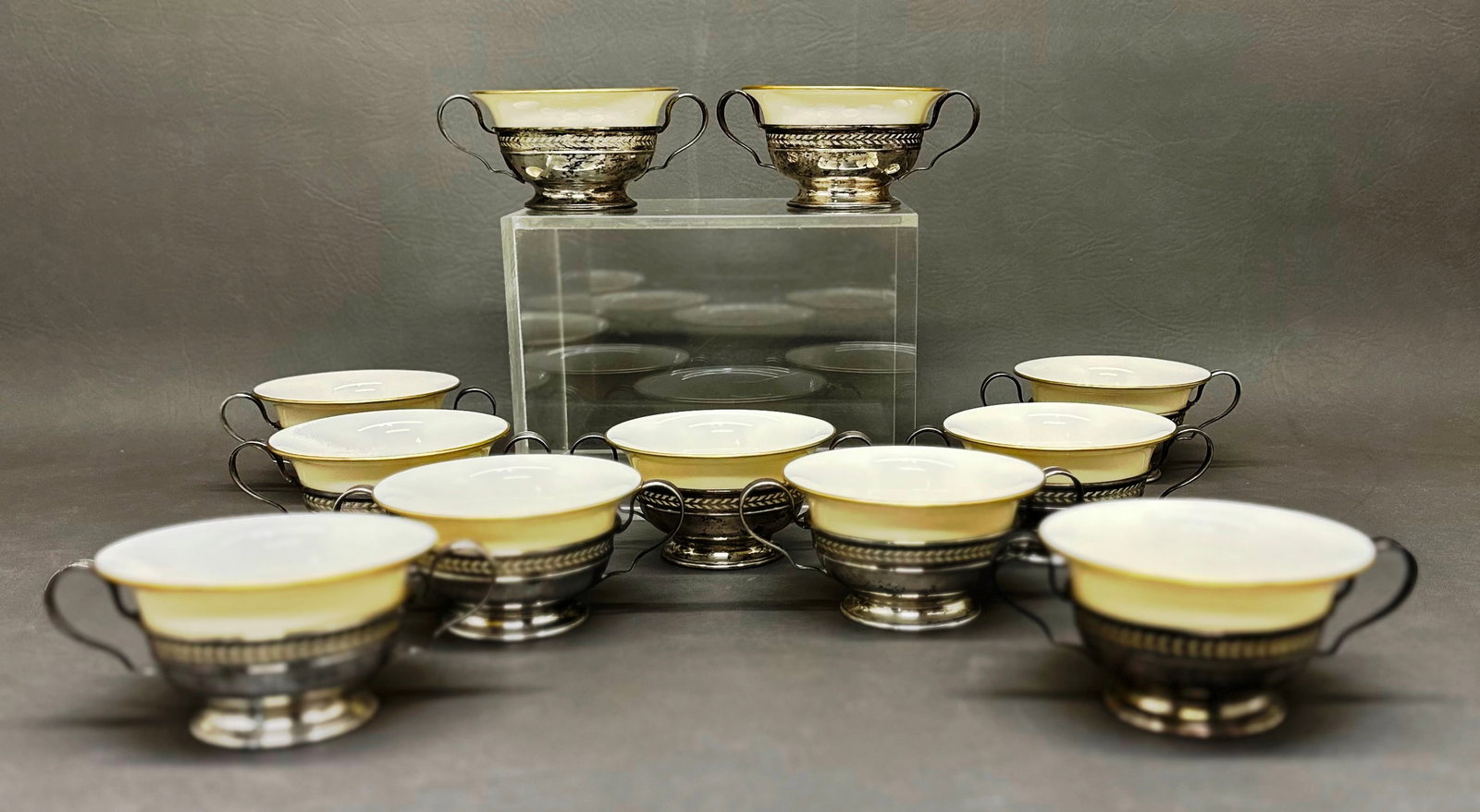 Sterling Silver 1914 set of 11 Bouillon cups with Lenox Liners: Set of 11 Bouillon cups marked sterling silver # B282 & hallmarks indicating 1914 Sheffield with Lenox gold rim fine porcelain liners with the artist palet mark indicating it's from the same erra & th