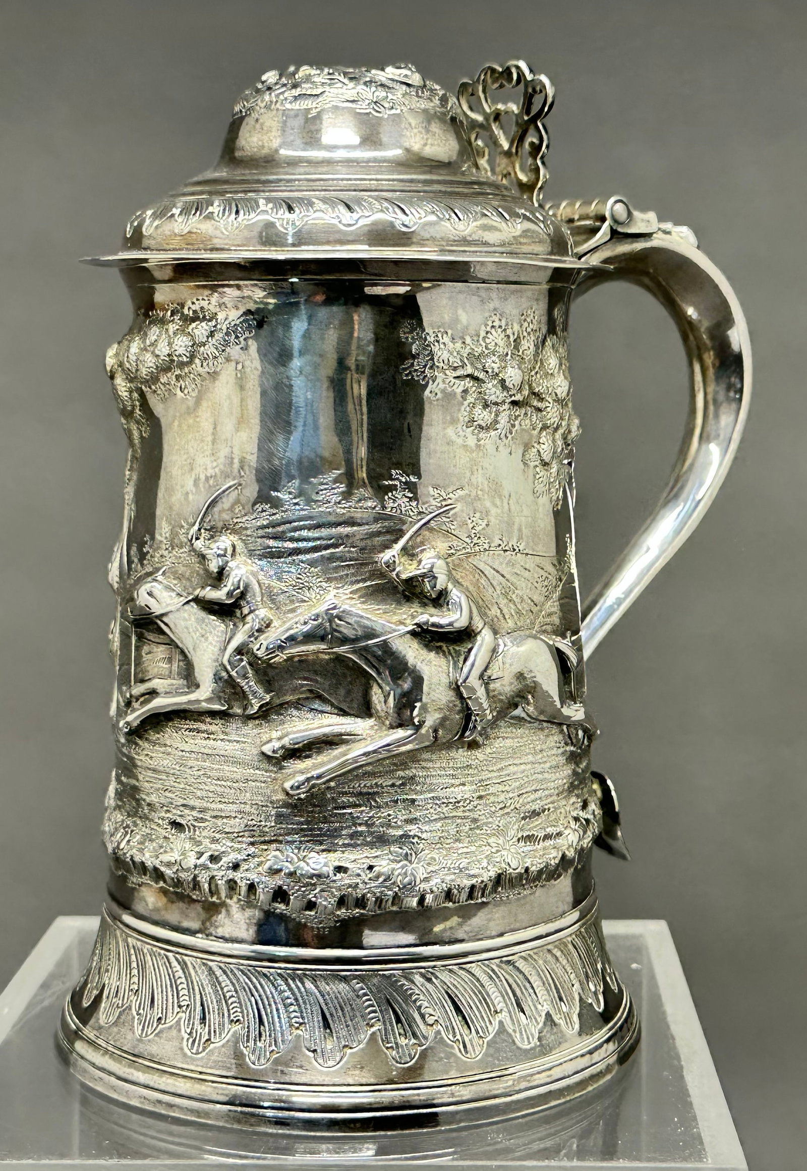 Sterling Silver 1806 Stein: London England 1806, we can't quite make out the mark to the far left. The actual size is 8-1/4" tall x 7" wide with handle x 4-7/8" base dia. Actual weight is 1lb-8.25oz. This is from the family of "