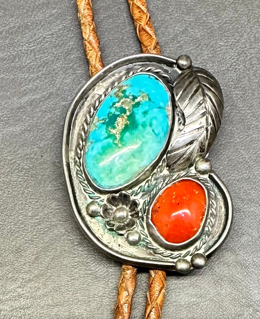 Navajo Bennett Silver Bolo: Not marked serling but is marked Bennett Pat. Pend. It has a 40" braid, and the silver is 2-1/8" x 1-1/2" & weighs 33g.