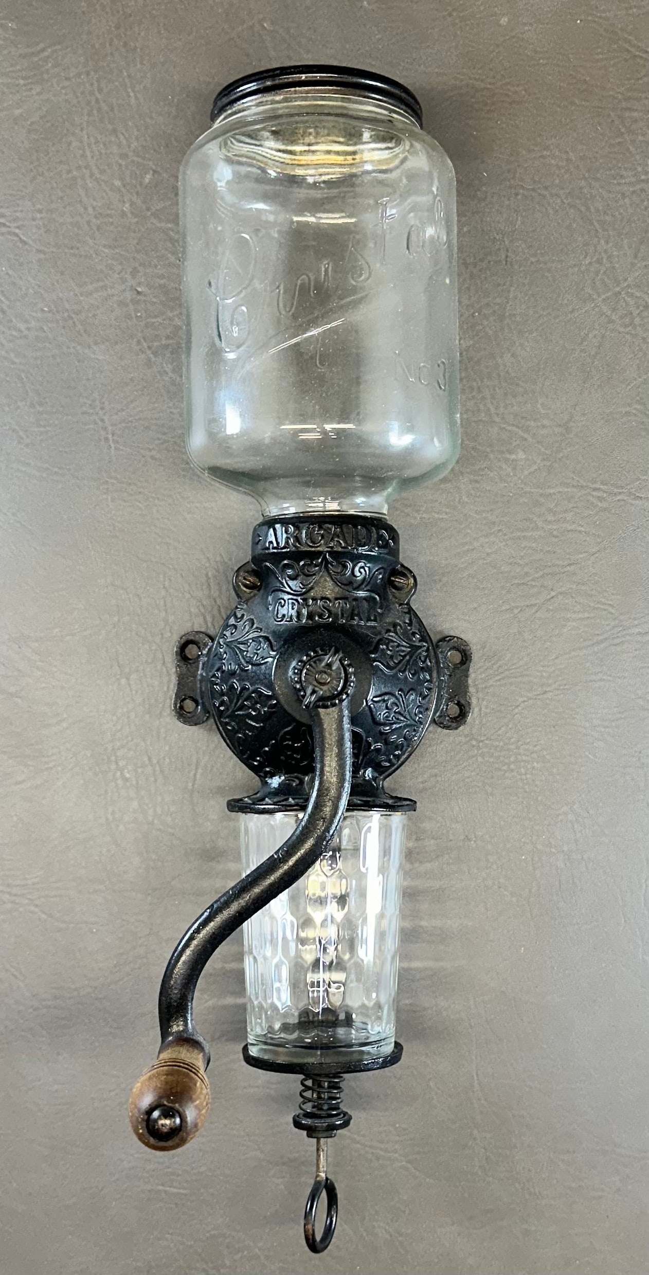 Arcade Wall Hanging Chrystal no 3 Coffee Grinder: This original antique coffee grinder was in use when we removed it from the wall. 19-1/4" top to bottom. This has been disassembled as seen in photos for safe shipping. Shipping dimensions given are f