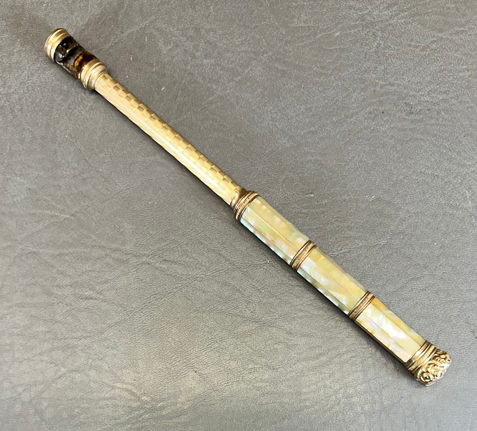 Antique Telescoping Opera Glass Handle: This is Mother of Pearl, Gold filled, & the holder part looks like possibly turtle shell. Ranges from 5-3/16" to 8-1/8" long. Shipping dimensions given are for the item(s) grouped as prepared for pack
