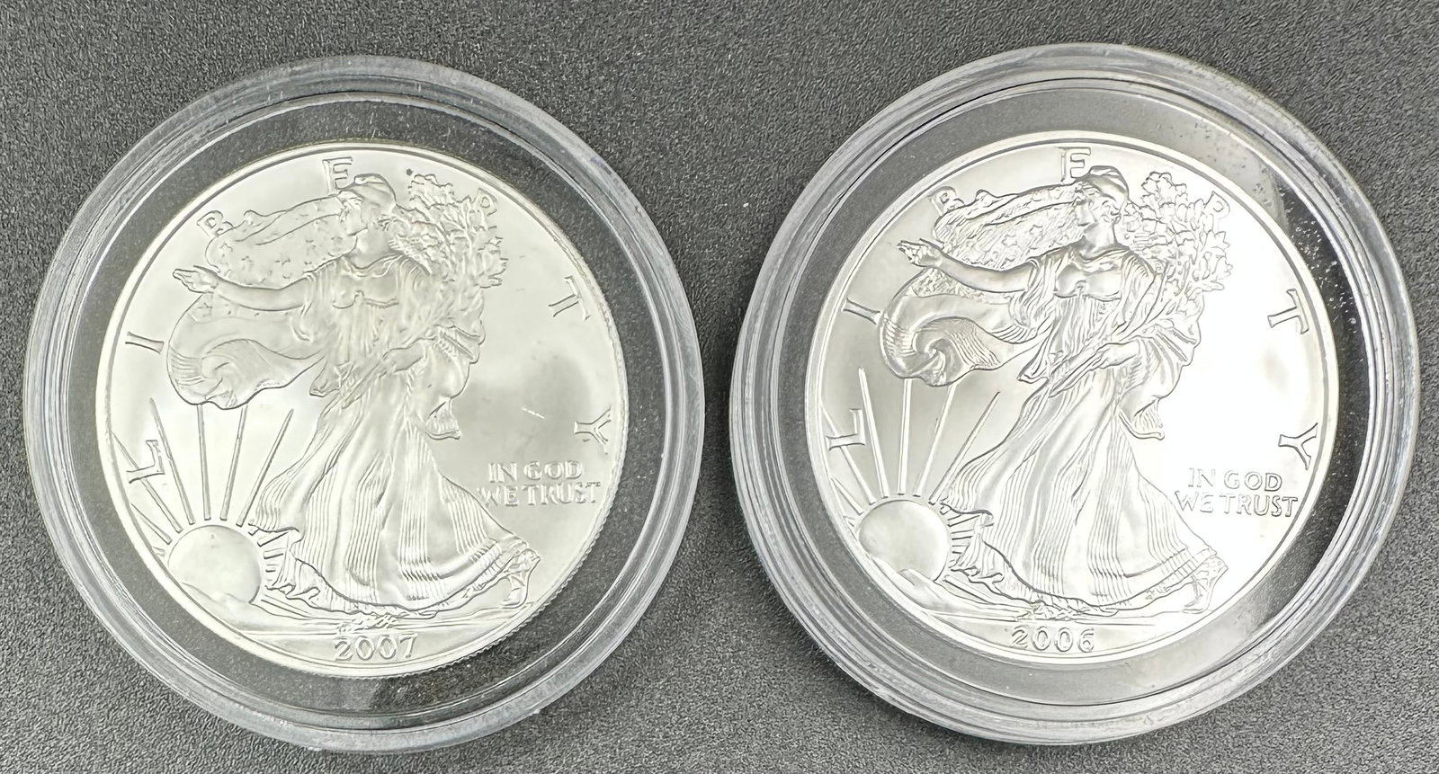 2 American Silver Eagles 2006 & 2007: You are bidding on 2 American Silver Eagles each in a hard plastic case. Shipping dimensions and given are for item(s) packaged.